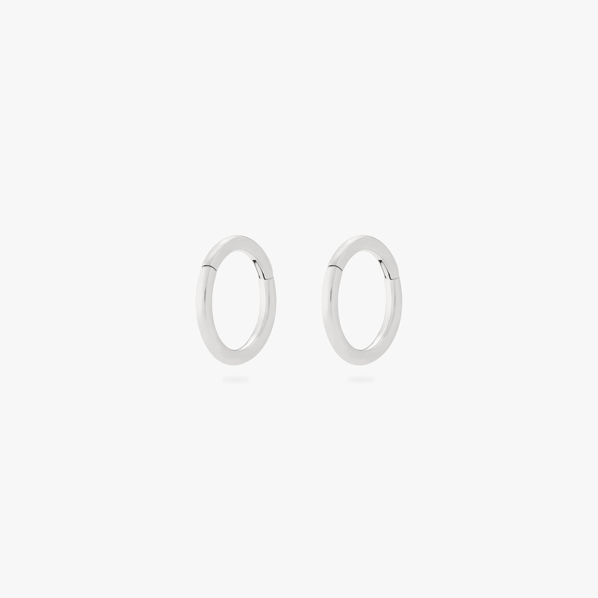 This is an image of a pair of silver clickers with 6mm inner diameters. [pair] color:null|silver