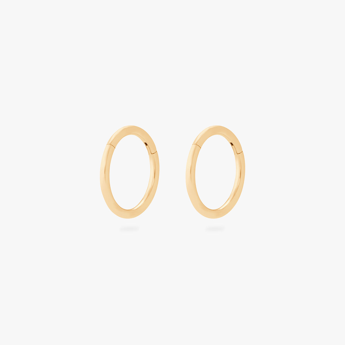This is an image of a pair of gold clickers with 8mm inner diameters. [pair] color:null|gold