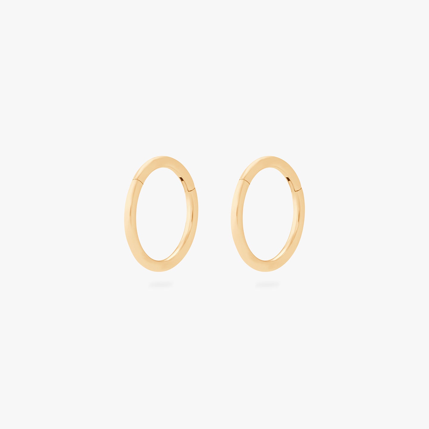 This is an image of a pair of gold clickers with 8mm inner diameters. [pair] color:null|gold