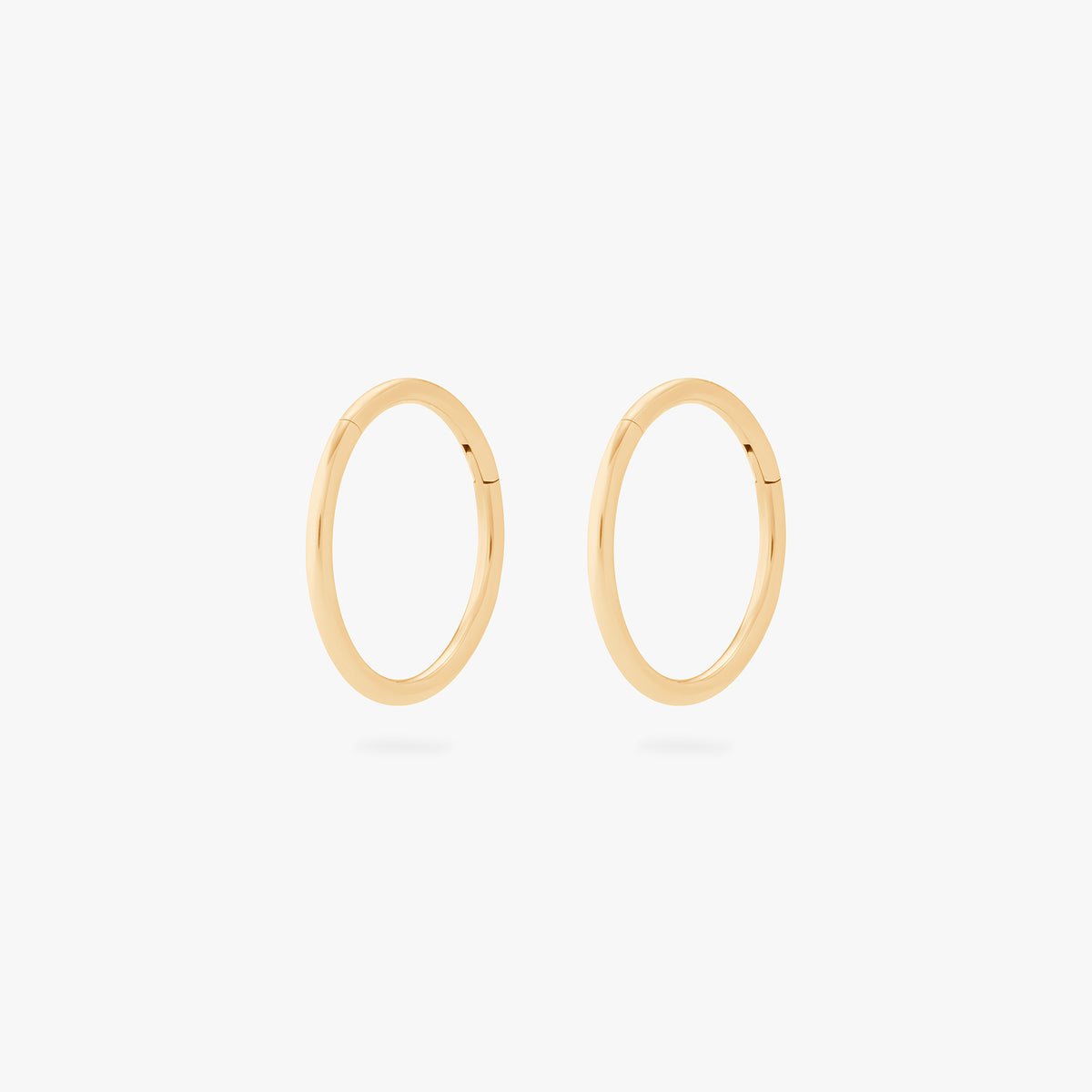 This is an image of a pair of gold clickers with 10mm inner diameters. [pair] color:null|gold