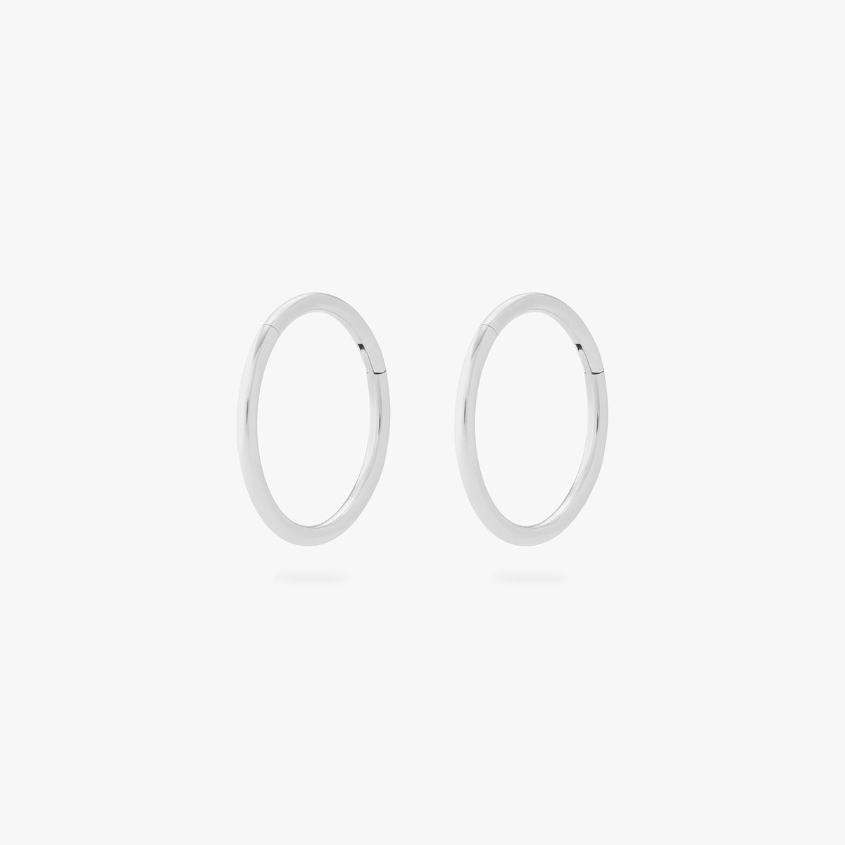 This is an image of a pair of silver clickers with 10mm inner diameters. [pair] color:null|silver