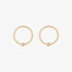 this image shows a pair of 10mm 14k yellow gold clickers with a cz bezel 