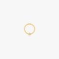 This image shows a 14k gold plated titanium front face clicker with a clear cz