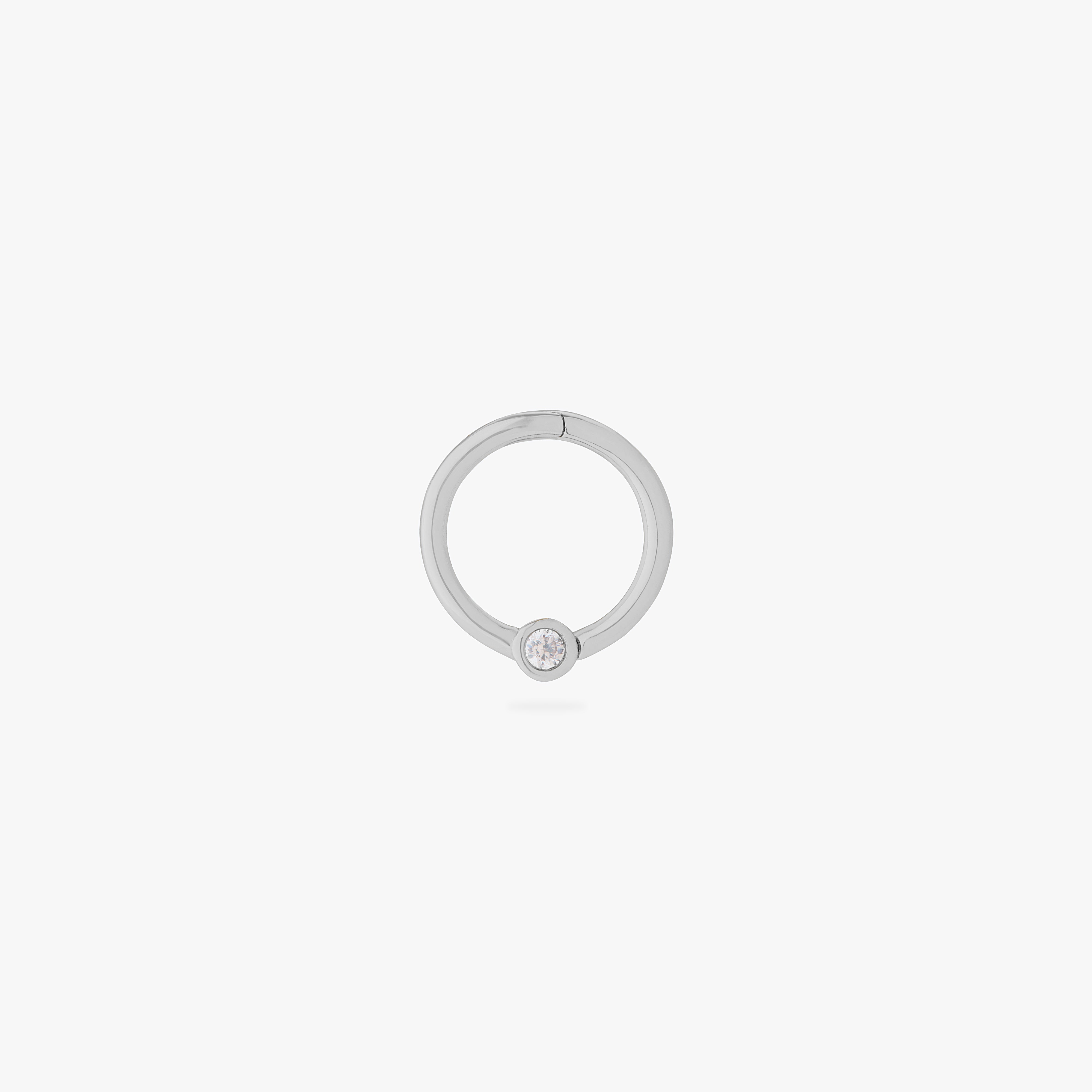 this image shows a 14k white gold plated titanium front face clicker with a clear cz - Main view