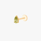 this image shows a side angle view of a Golden Titanium pear flatback with a green cz stone. 