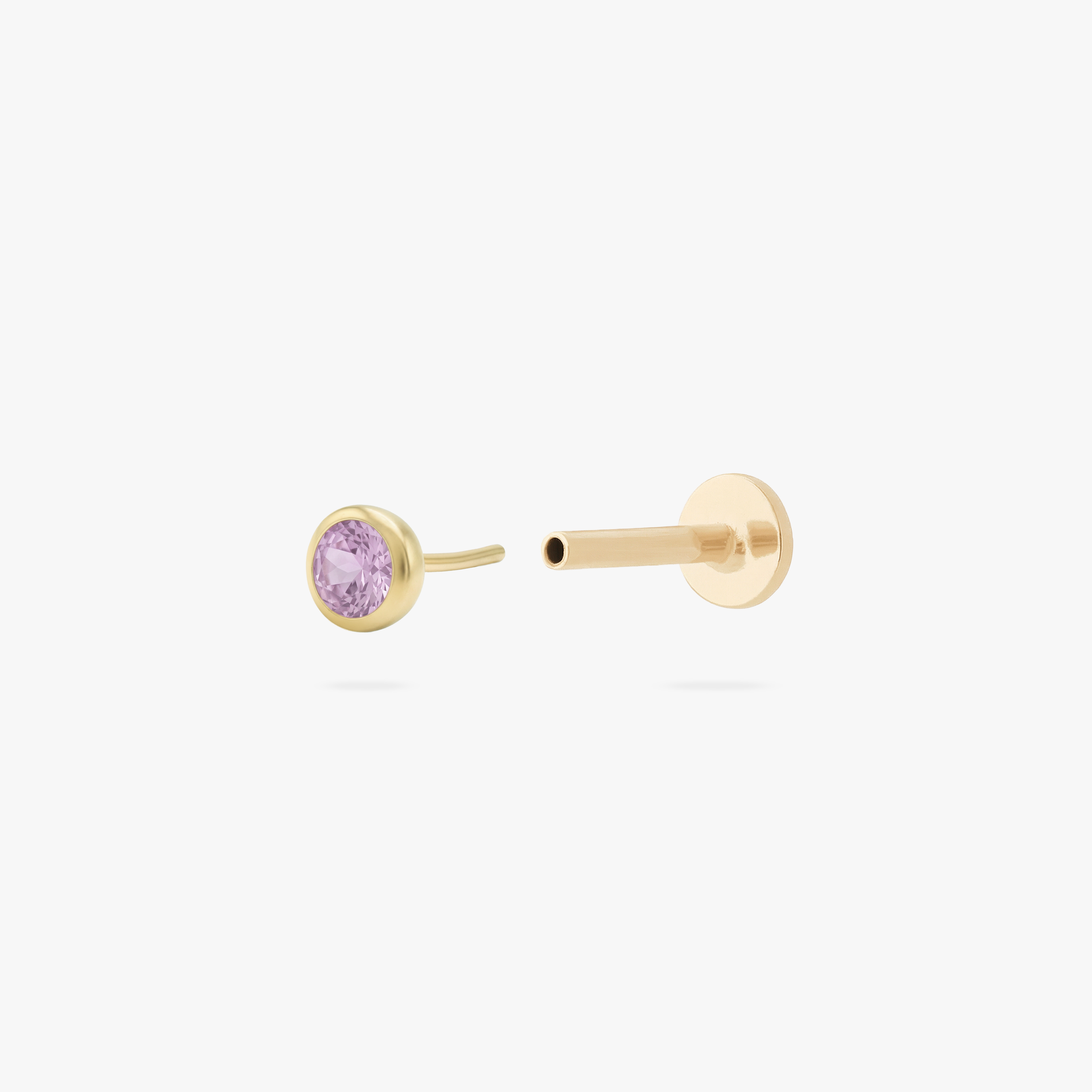 This is an image of a gold toned flatback stud with a 3mm, bezel set pink CZ stone. - Alternative view 2