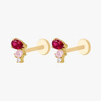 This is an image of the side view of  a pair of the golden ti pear cluster flatback. the earring has three pear cluster cz. The top is red, middle stone is light pink and the bottom is clear.