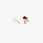 This is an image of the golden ti pear cluster flatback separated from the labret. the earring has three pear cluster cz. The top is red, middle stone is light pink and the bottom is clear.