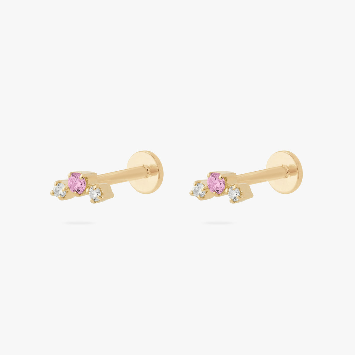this image shows a pair of gold plated micro cluster flatbacks with two clear and one pink cz stones