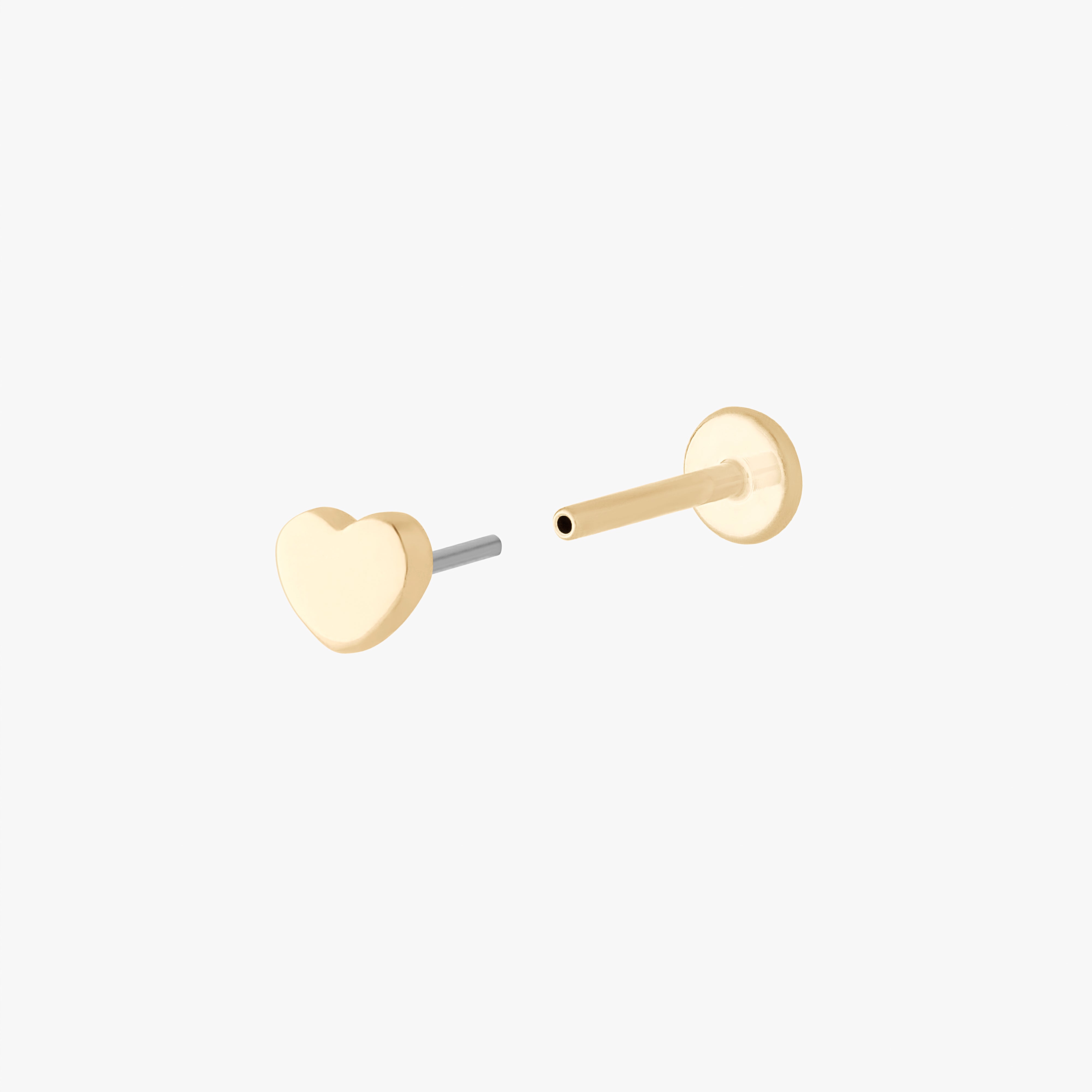 This is an image of a 14k gold flatback stud in the shape of a heart. color:null|14k gold