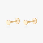 This image shows a pair of 14k yellow gold heart flatback studs 