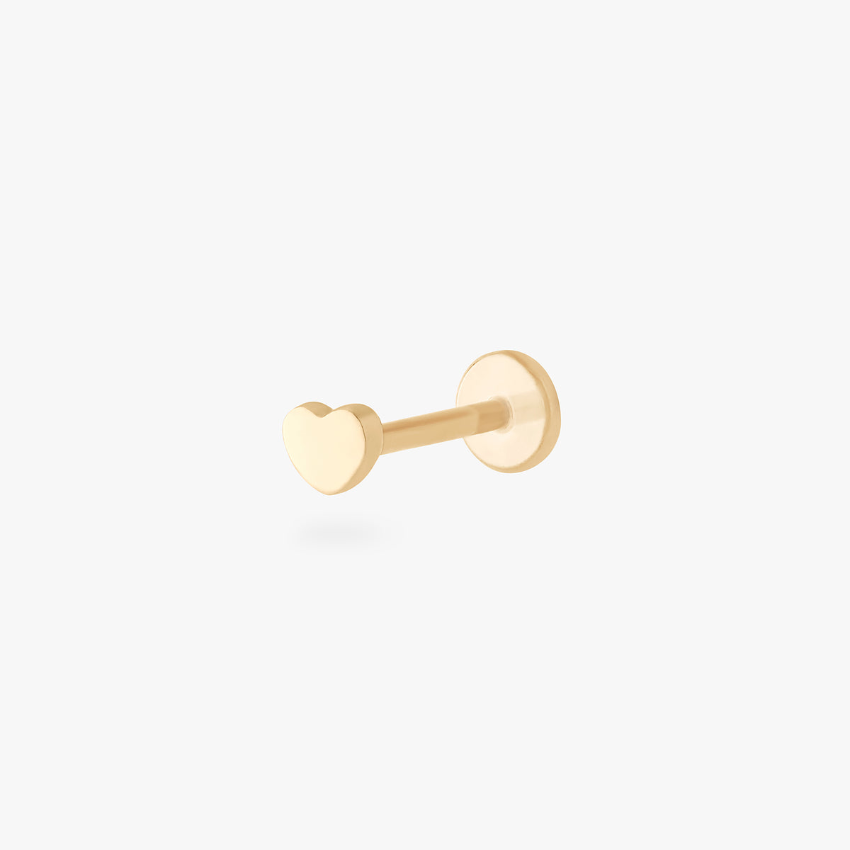 This is an image of a 14k gold flatback stud in the shape of a heart. 
