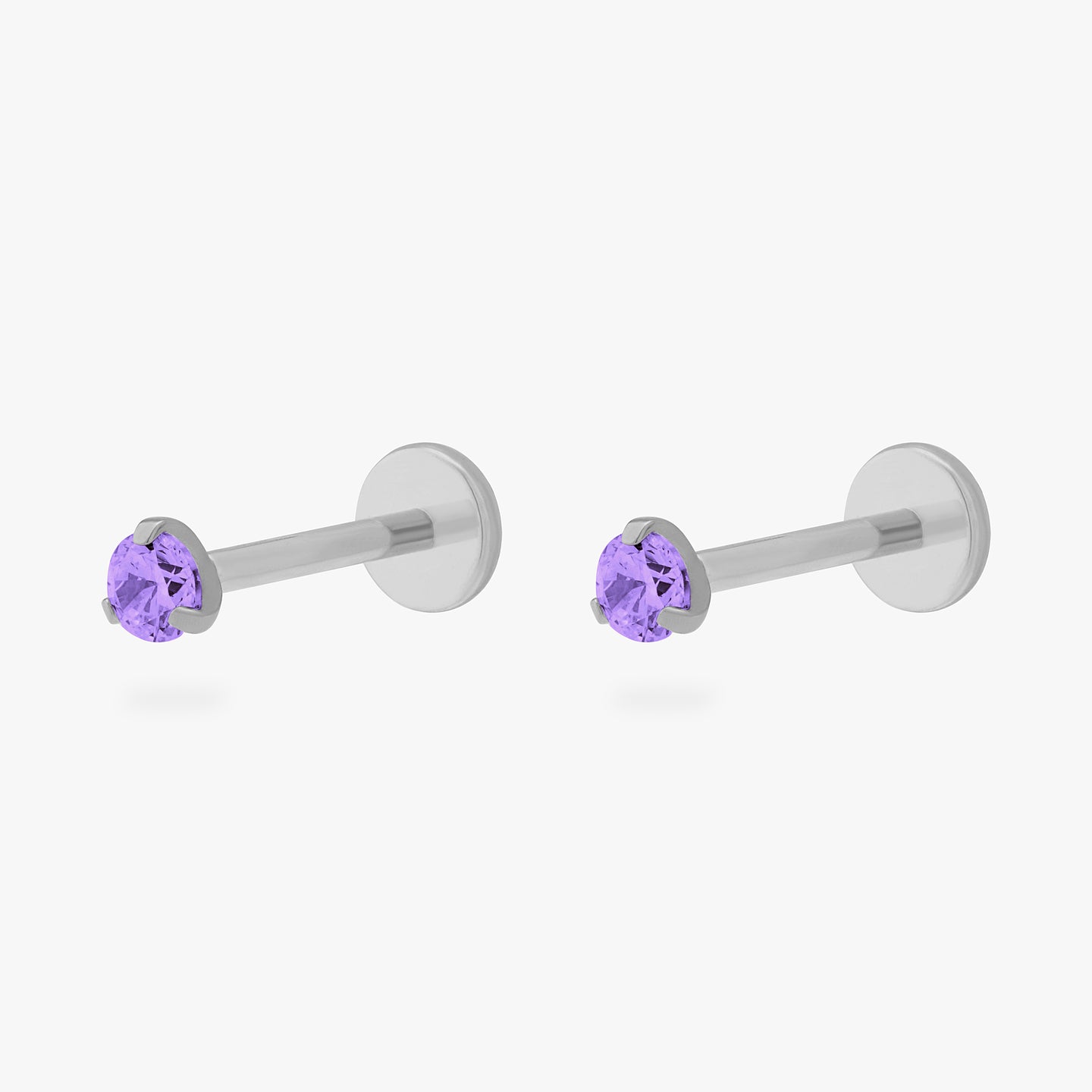 This is a pair of silver toned titanium flatback studs with mini amethyst cz stones. [pair] color:null|amethyst