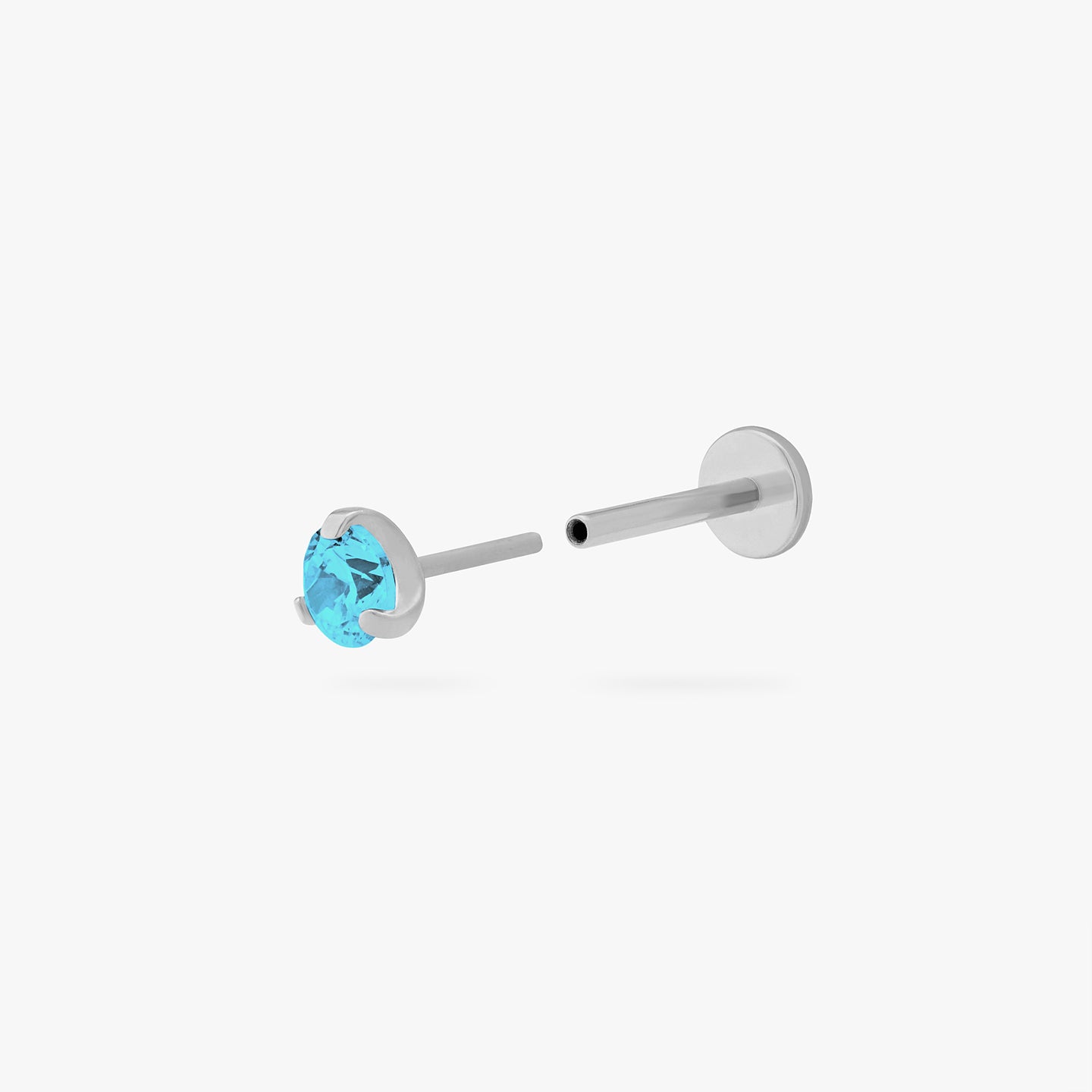 This is a silver toned titanium flatback stud with an aquamarine mini cz stone. color:null|aquamarine