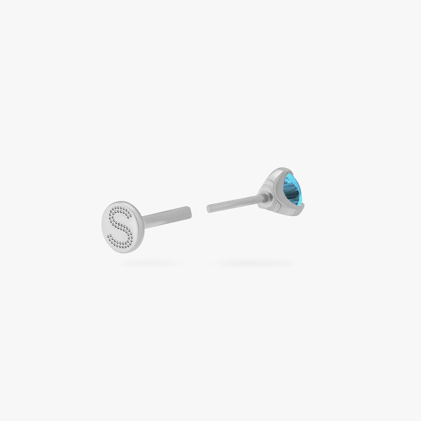 This is a silver toned titanium flatback stud with an aquamarine mini cz stone. color:null|aquamarine