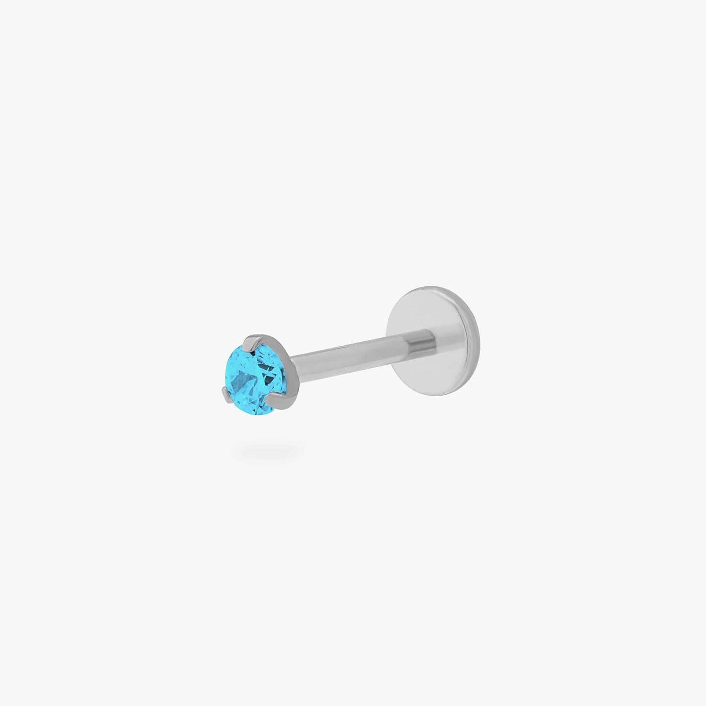 This is a silver toned titanium flatback stud with an aquamarine mini cz stone. color:null|aquamarine