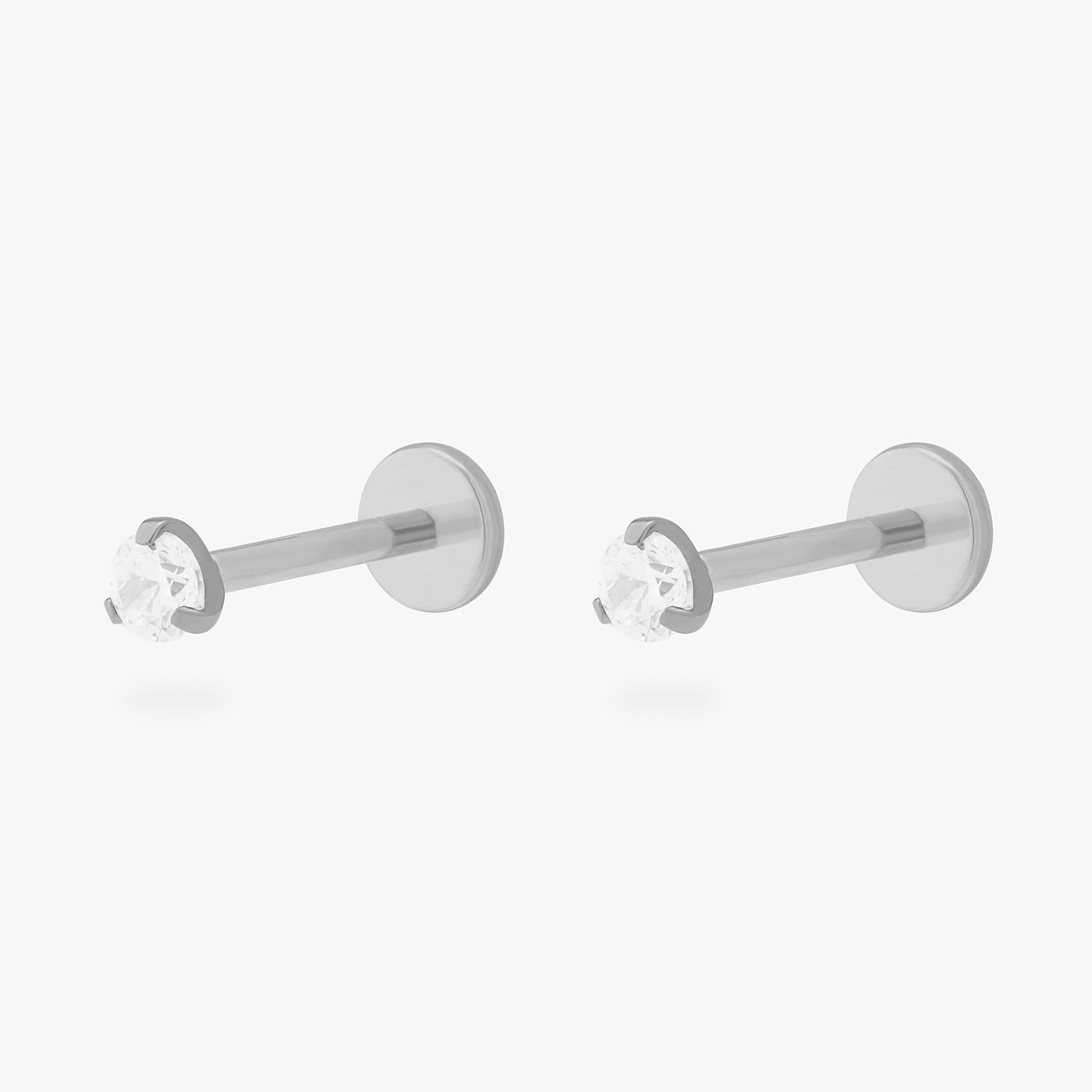 This is a pair of silver toned titanium flatback studs with mini crystal cz stones. [pair] color:null|crystal