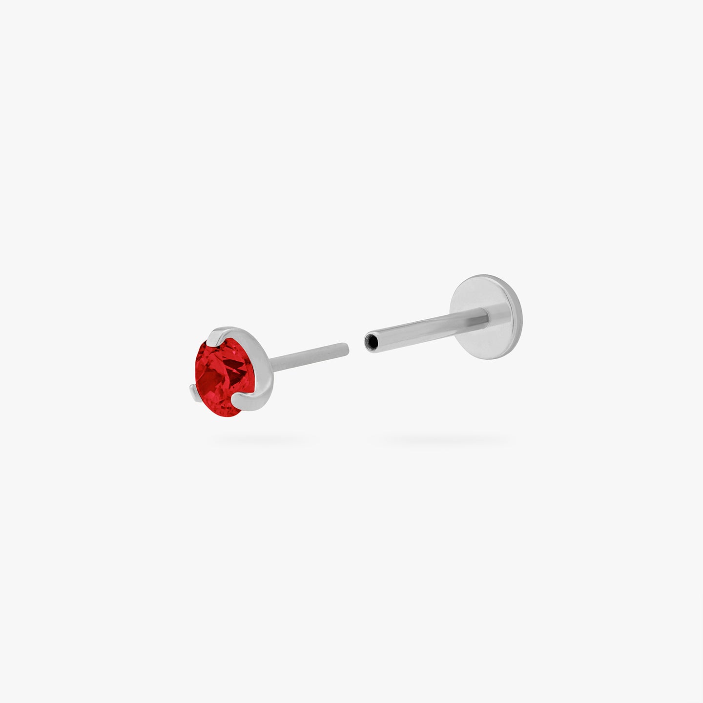 This is a silver toned titanium flatback stud with a garnet mini cz stone. color:null|garnet