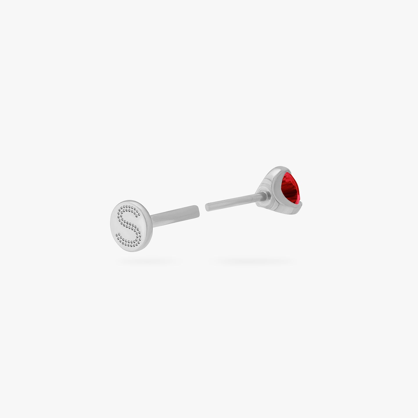 This is a silver toned titanium flatback stud with a garnet mini cz stone. color:null|garnet