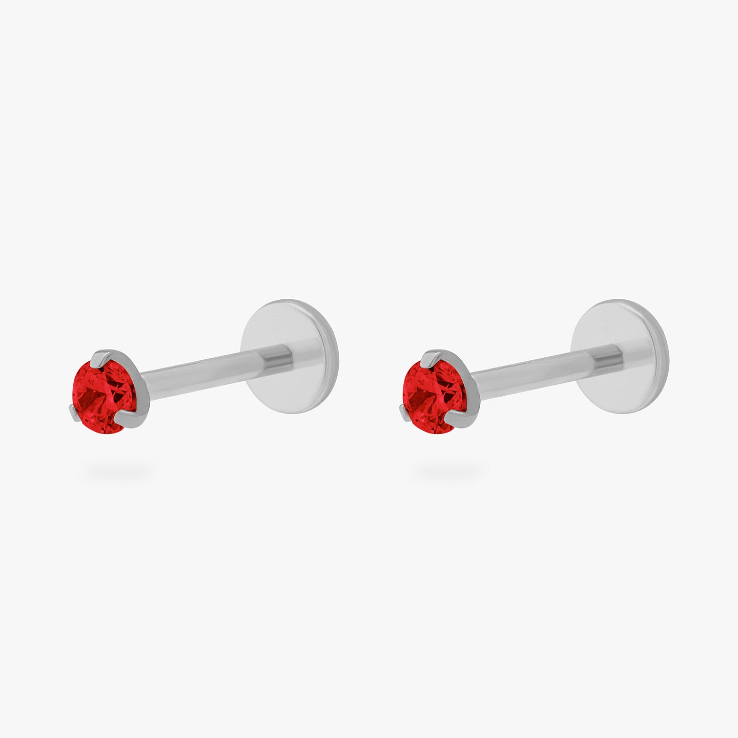 This is a pair of silver toned titanium flatback studs with mini garnet cz stones. [pair] color:null|garnet