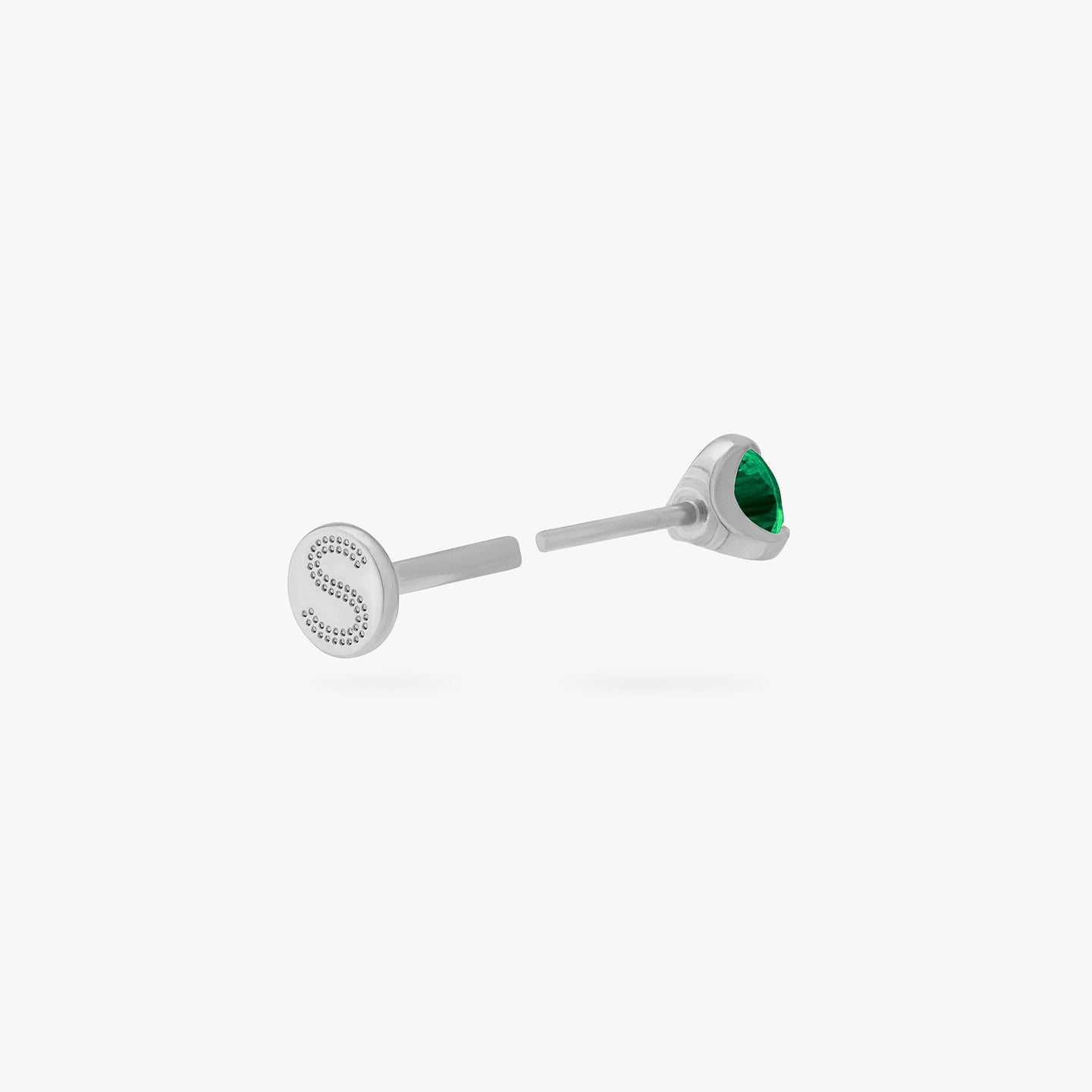 This is a silver toned titanium flatback stud with an emerald mini cz stone. color:null|emerald