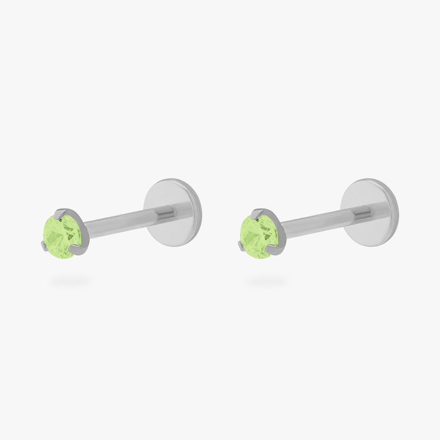 This is a pair of silver toned titanium flatback studs with mini peridot cz stones. [pair] color:null|peridot