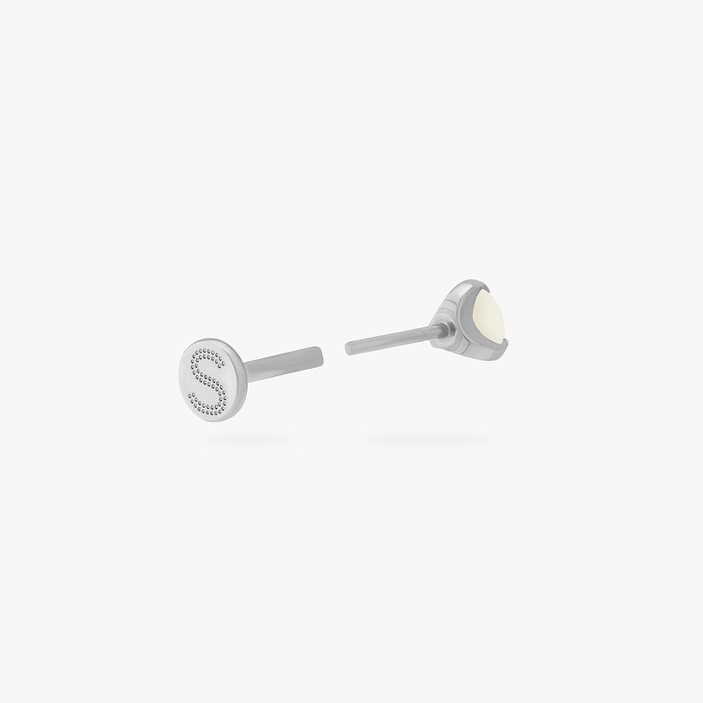 This is a silver toned titanium flatback stud with a mini pearl stone. color:null|pearl