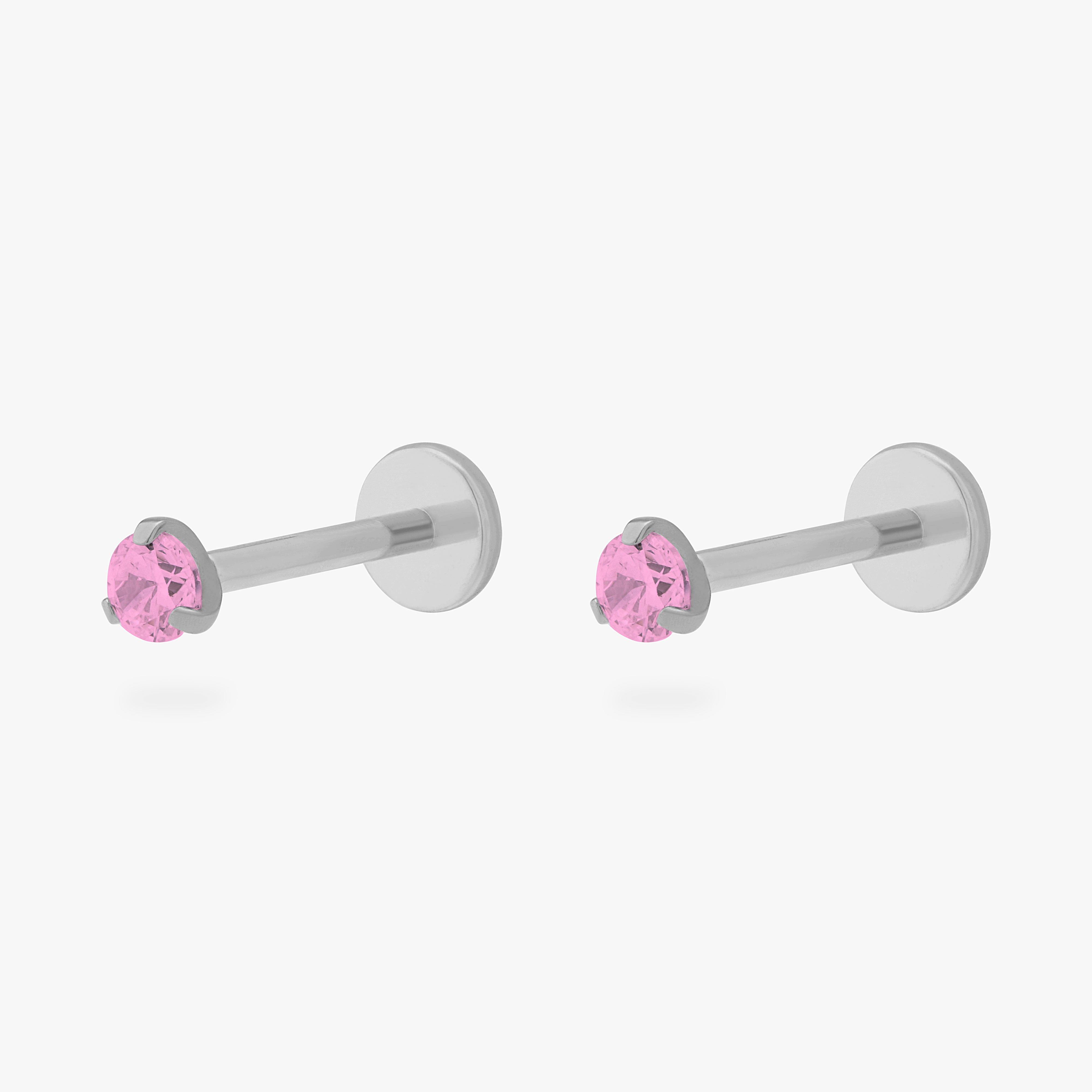 Pair of titanium cz flatback studs with a pink cz stone
