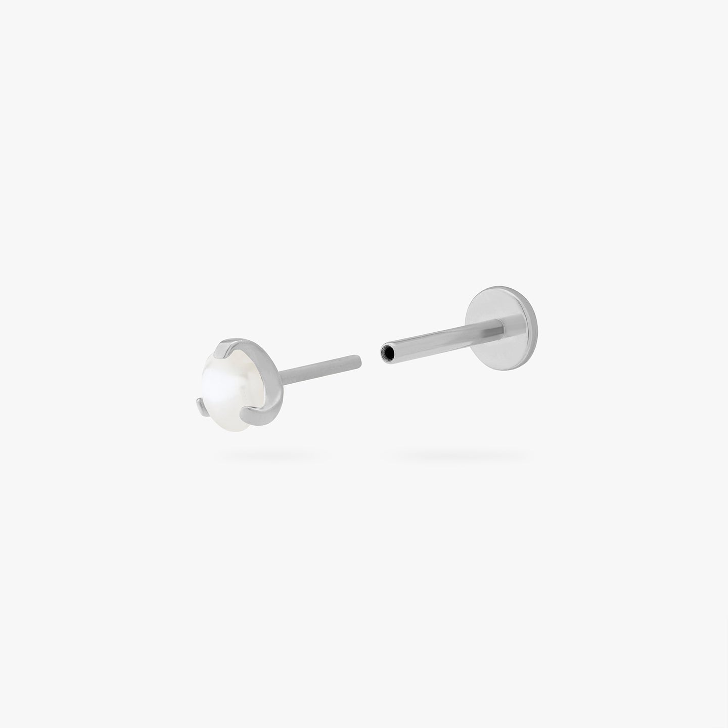 This is a silver toned titanium flatback stud with a mini pearl stone. color:null|pearl