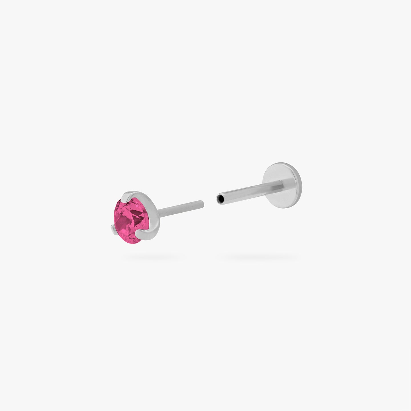 This is a silver toned titanium flatback stud with a mini ruby cz stone. color:null|ruby