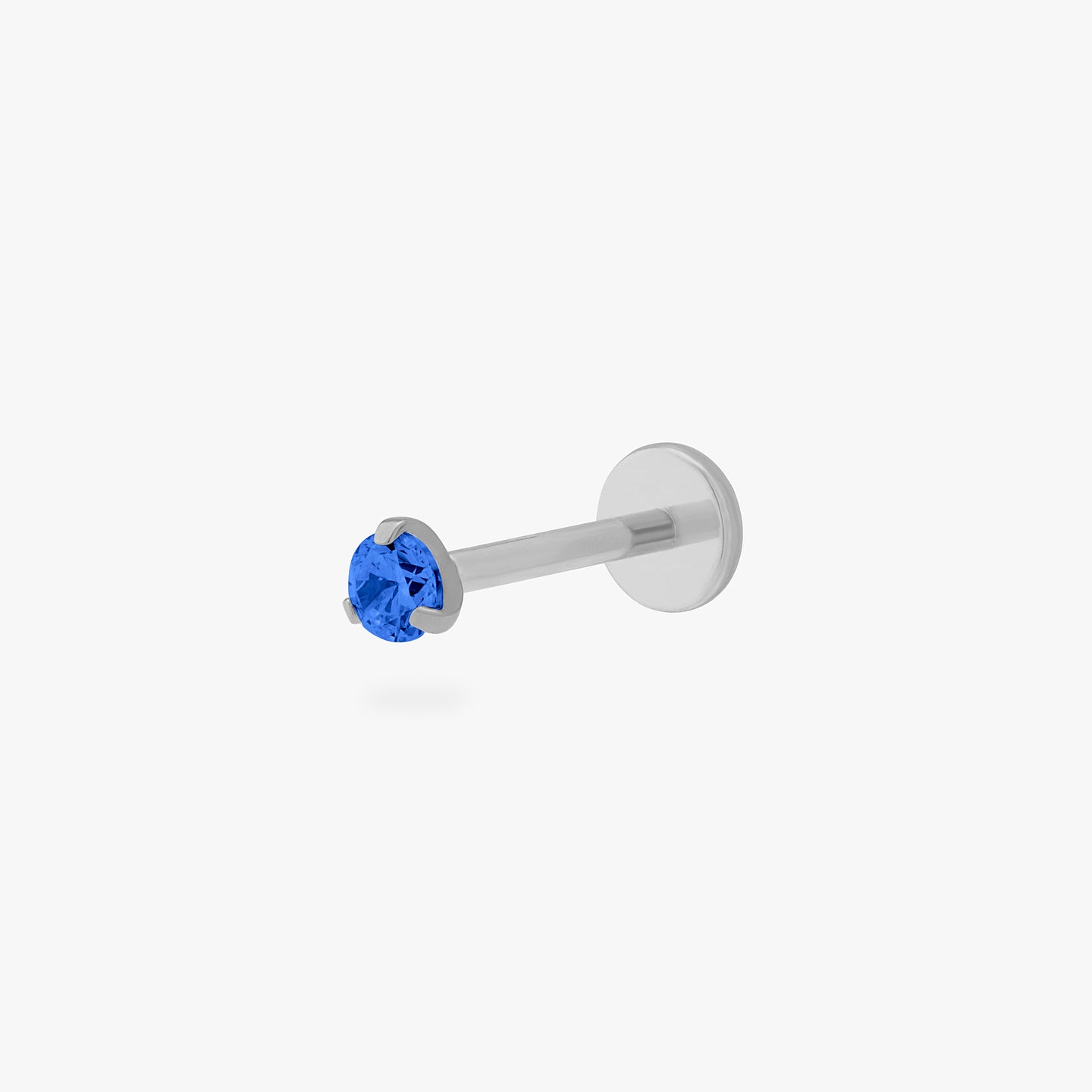 This is a silver toned titanium flatback stud with a mini sapphire cz stone. color:null|sapphire