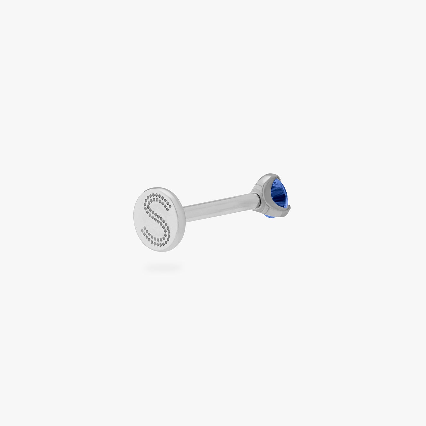 This is a silver toned titanium flatback stud with a mini sapphire cz stone. color:null|sapphire