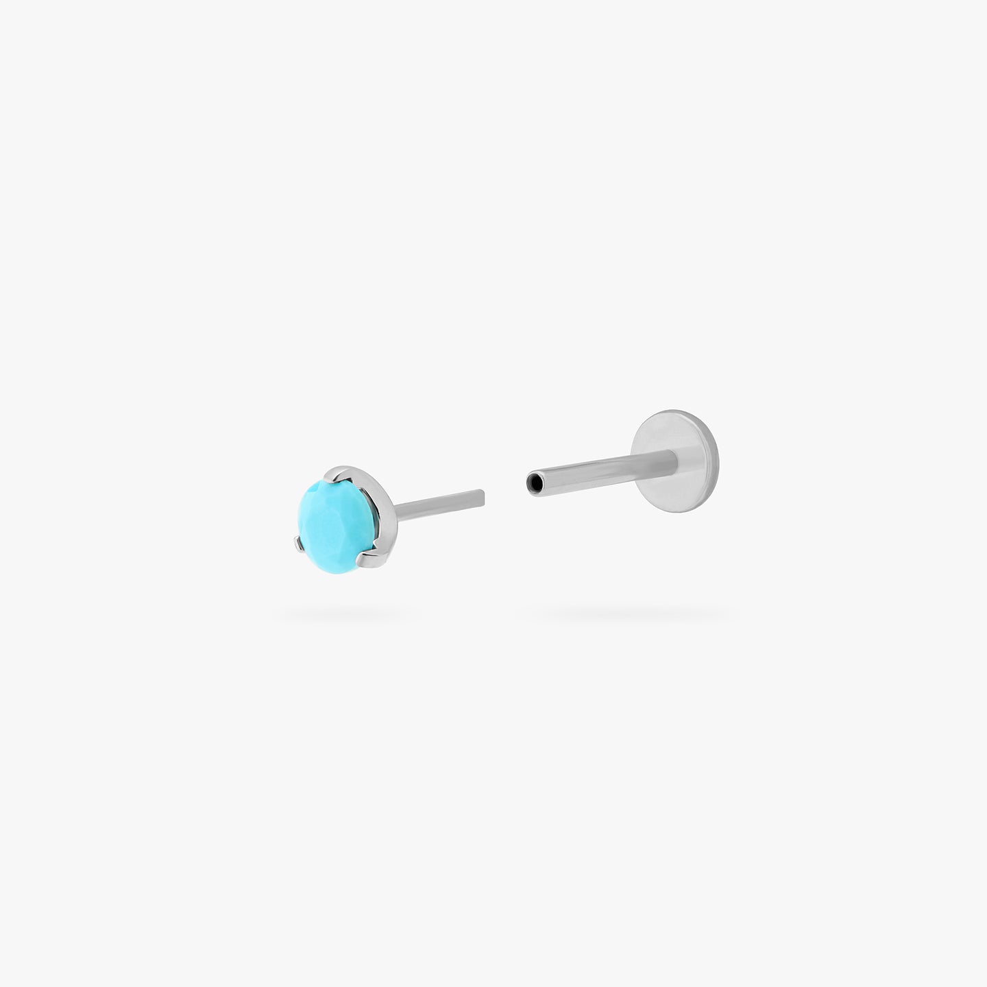 This is a silver toned titanium flatback stud with a mini turquoise cz stone. color:null|turquoise