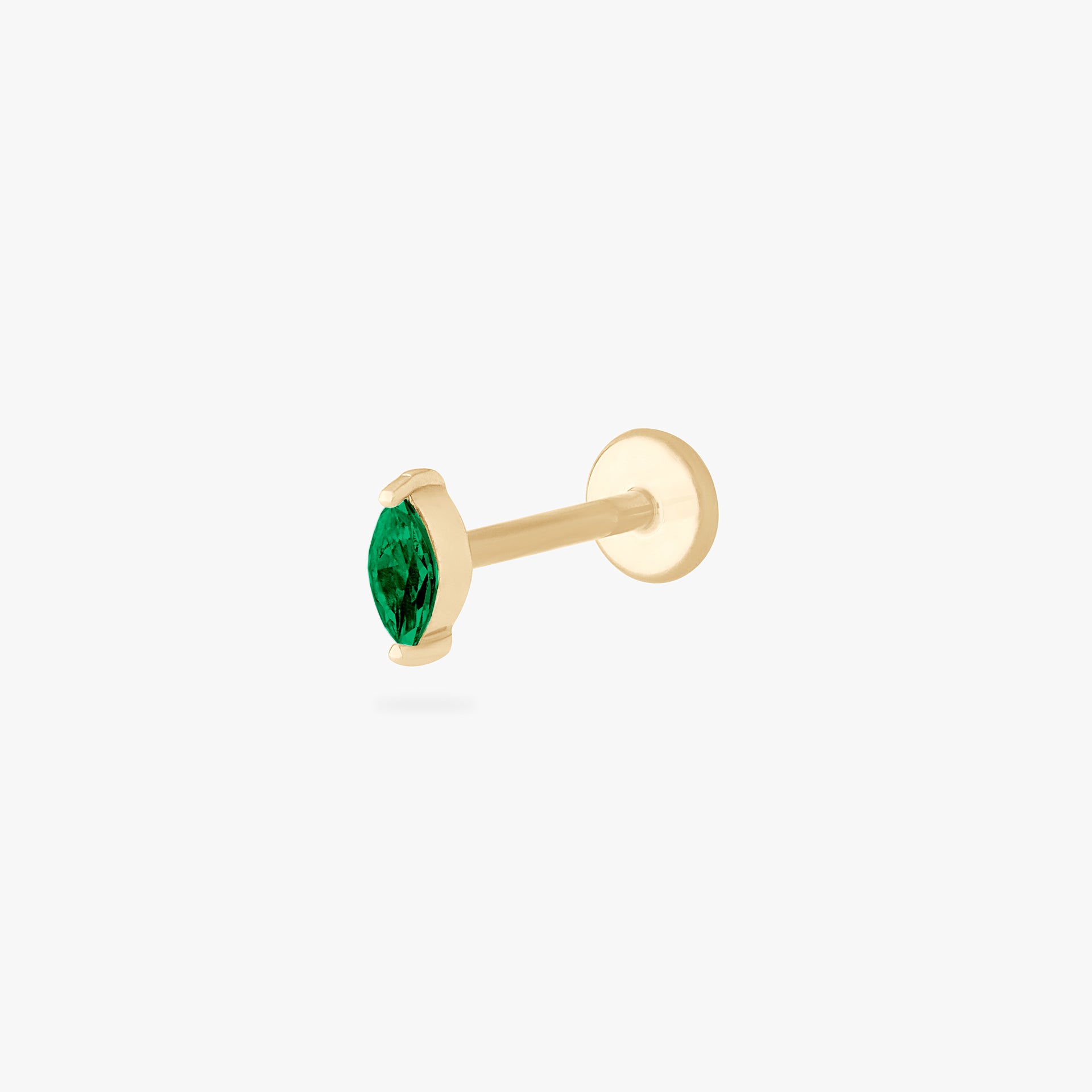 This is an image of a 14k gold flatback with a marquise setting and green stone. color:null|14k gold/green