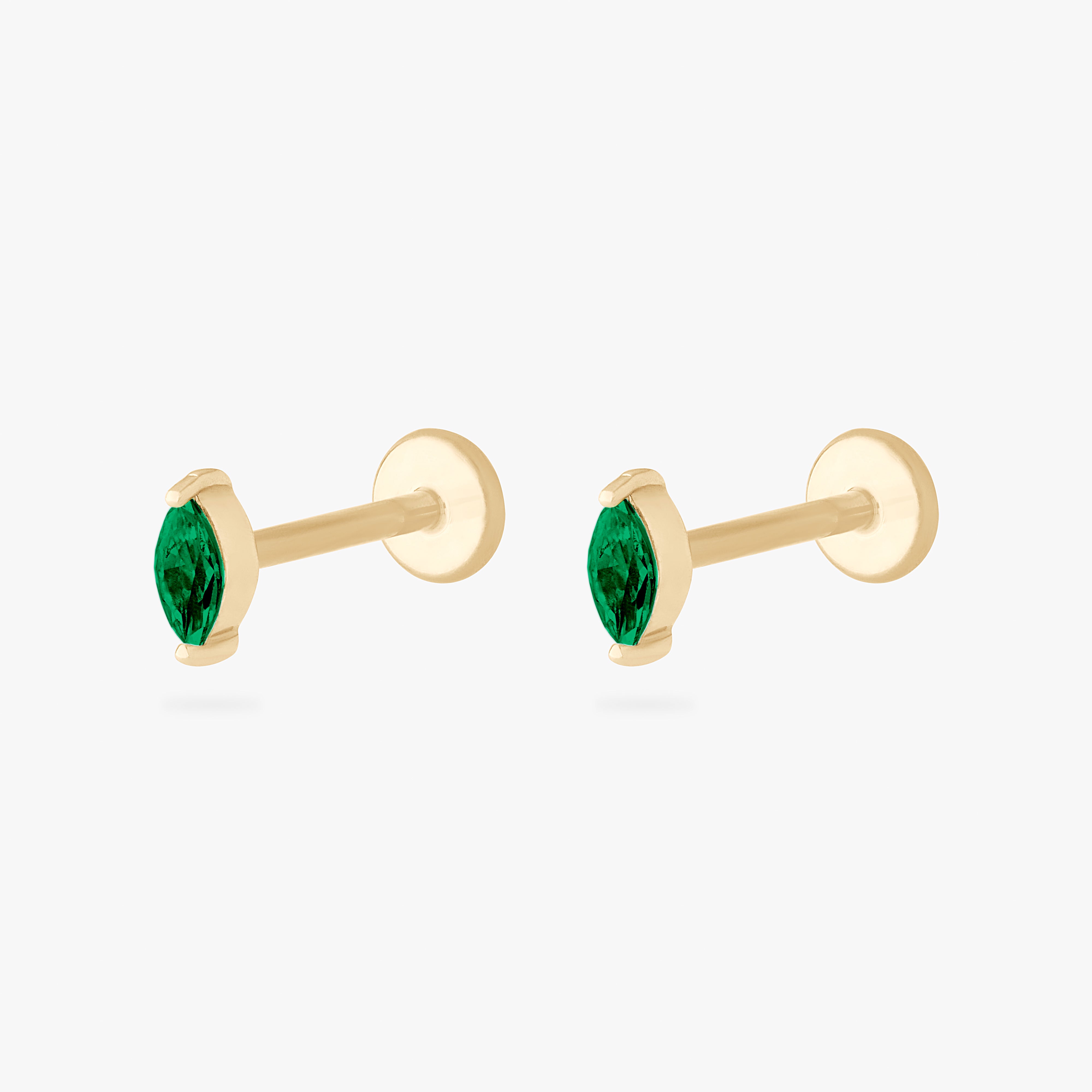 This is an image of a 14k gold flatback with a marquise setting and green stone. [pair] color:null|14k gold/green