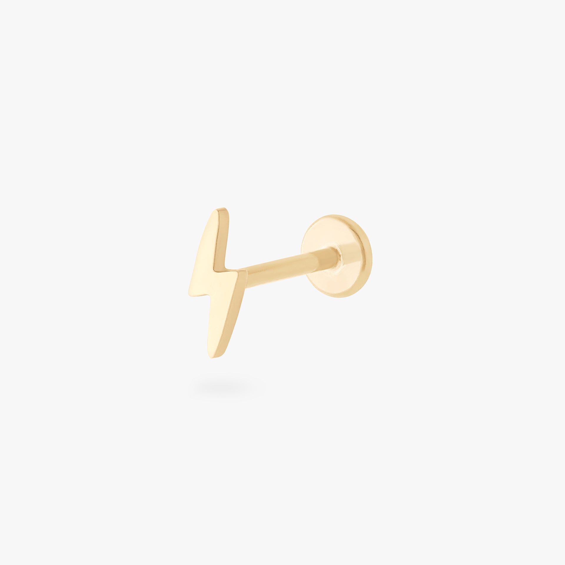 This is an image of a 14k gold flatback stud that is shaped like a lightning bolt. - Main view