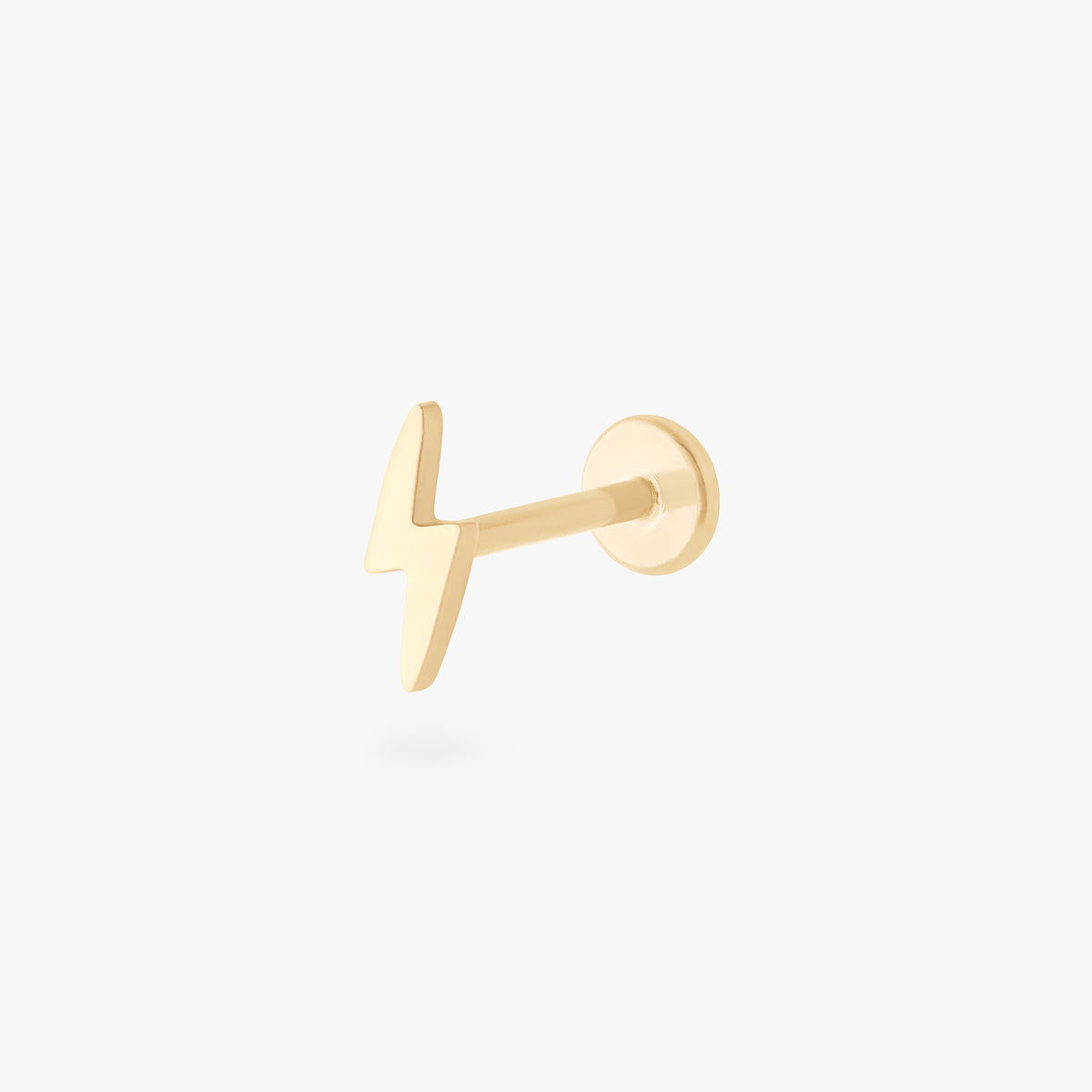 This is an image of a 14k gold flatback stud that is shaped like a lightning bolt.