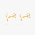 This is an image of a pair of 14k gold flatback studs that are shaped like lightning bolts.