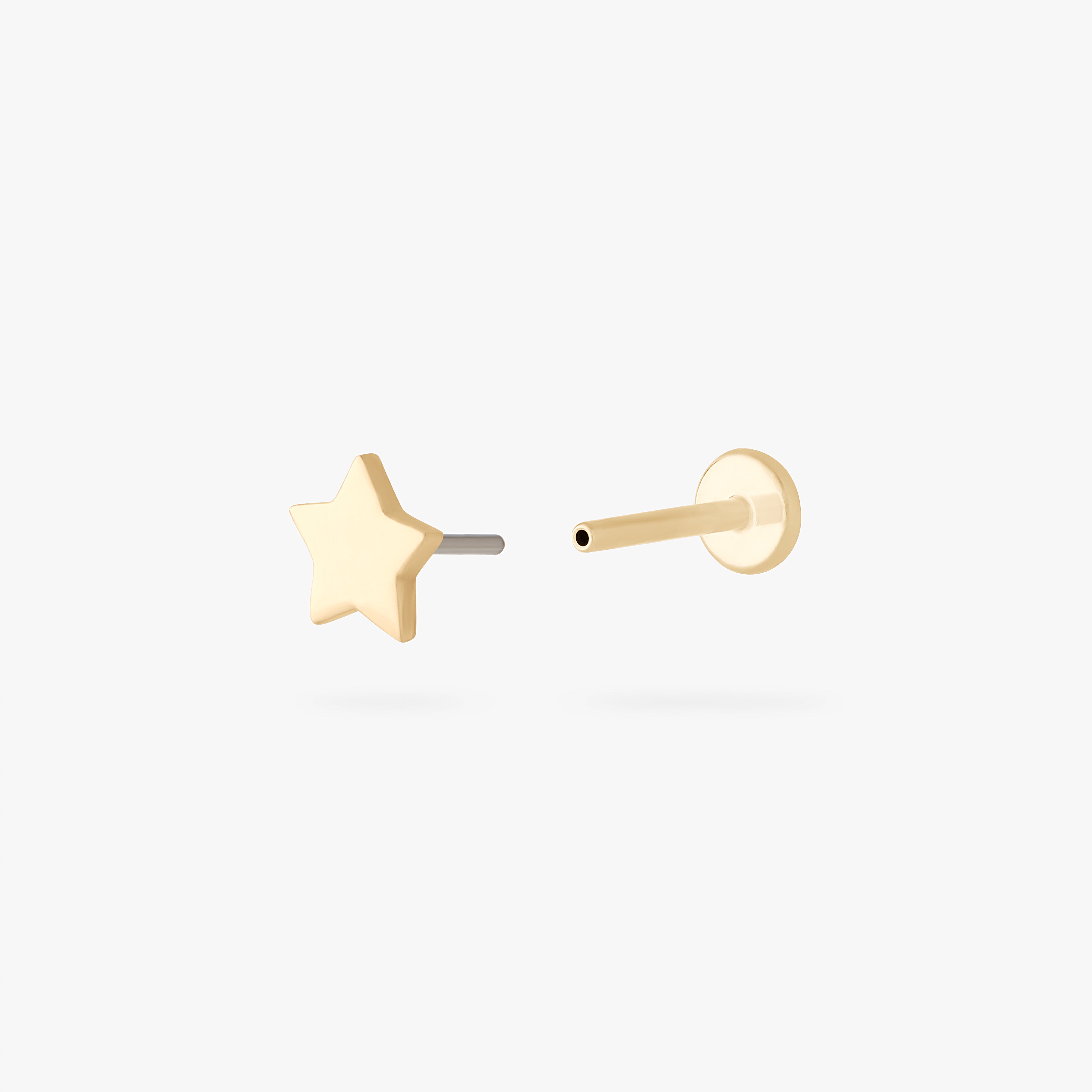 This is an image of a 14K gold flatback stud that is in the shape of a star.