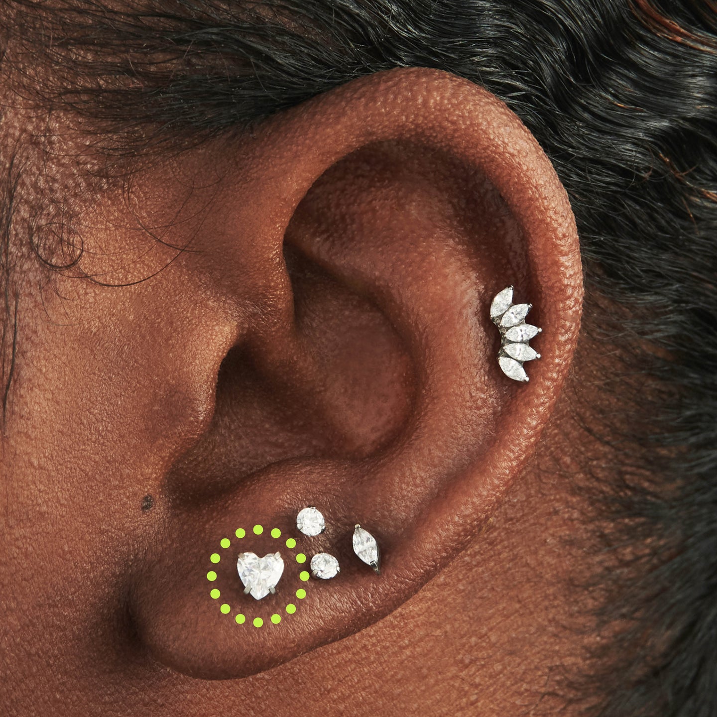 on ear featuring a titanium cz heart flatback stud in silver with a clear stone [hover] color:null|silver/clear