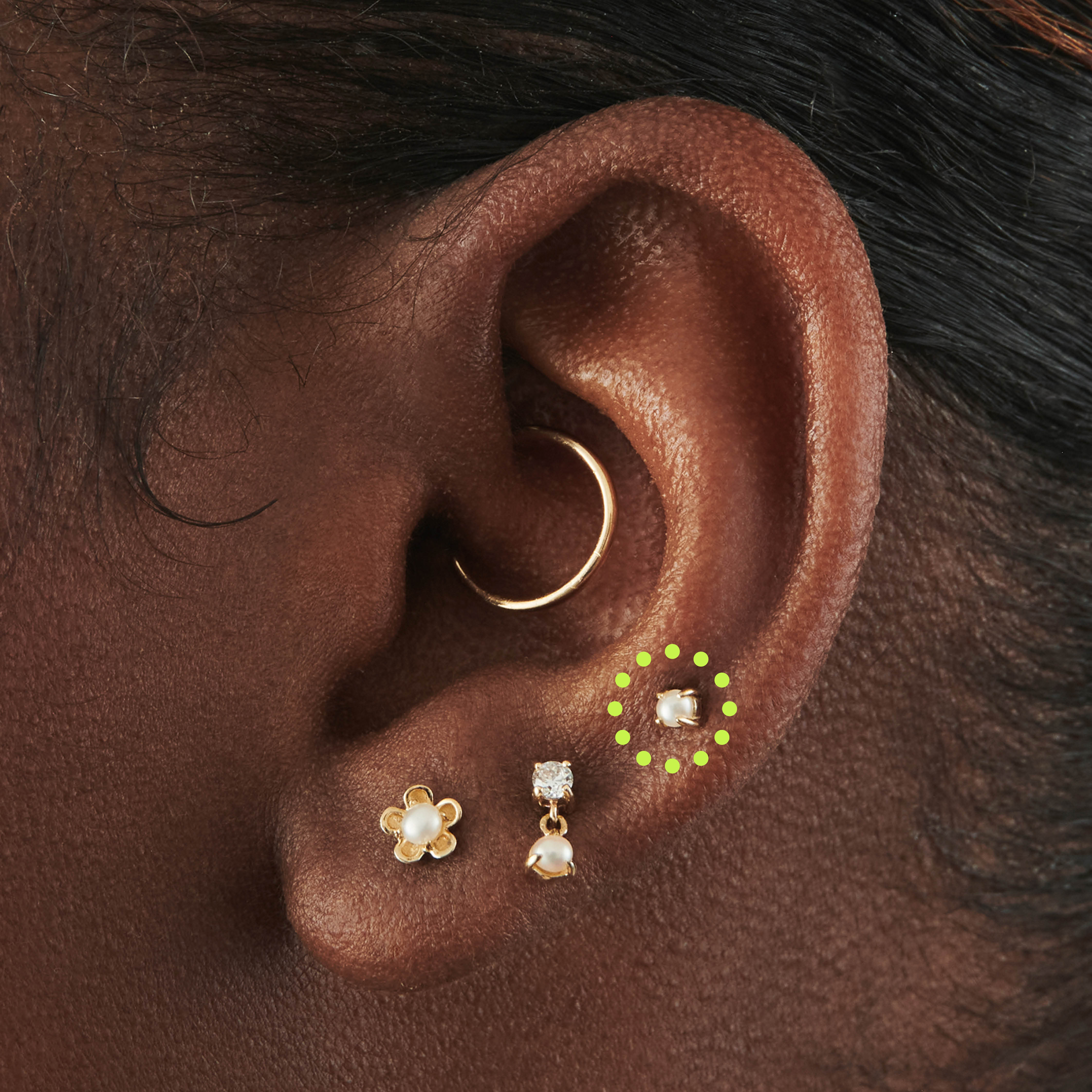This is an image of a 14k gold flatback with a pearl stone on ear. [hover] color:null|14k gold