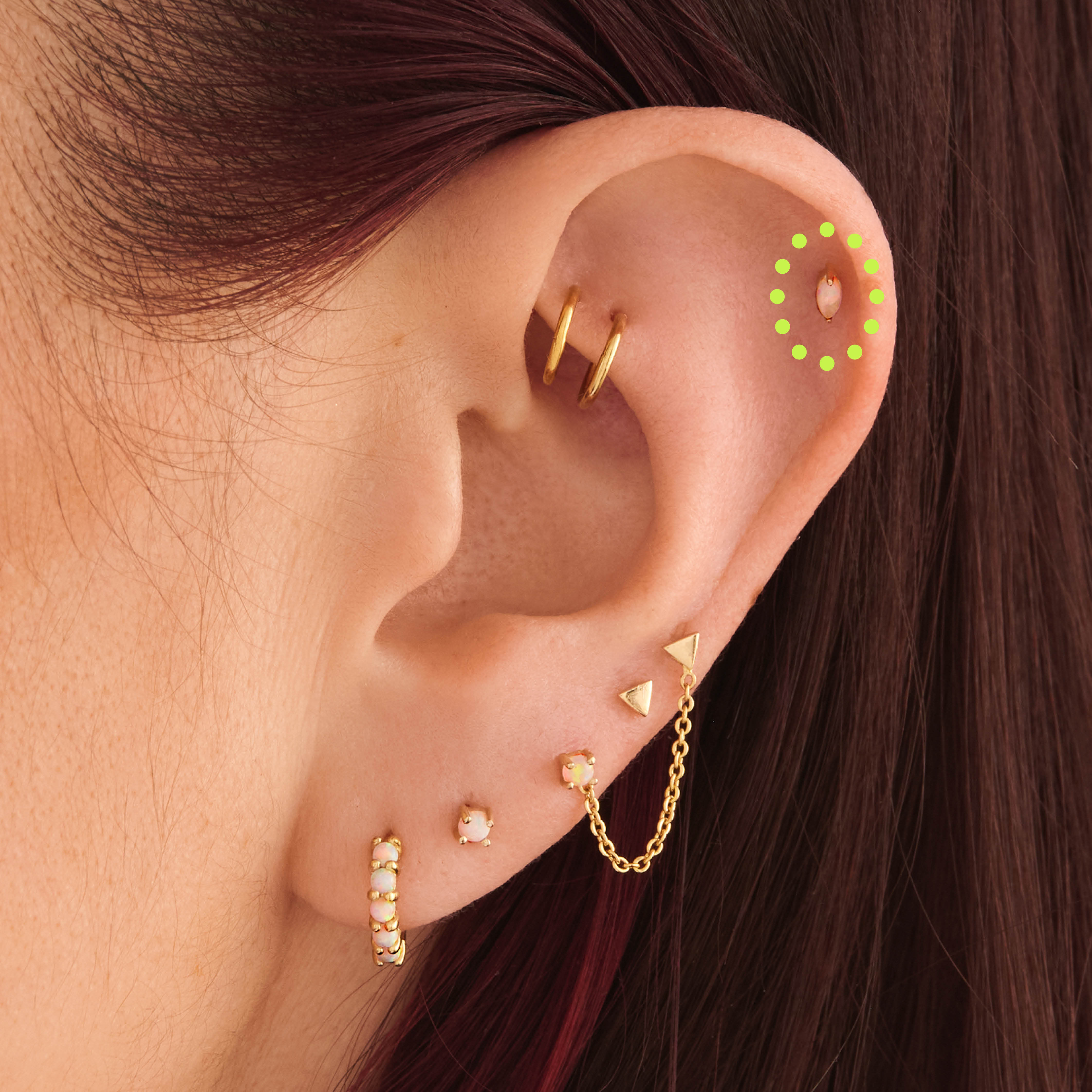 This is an image of a 14k gold flatback with a marquise setting and opal stone on ear. [hover] color:null|14k gold