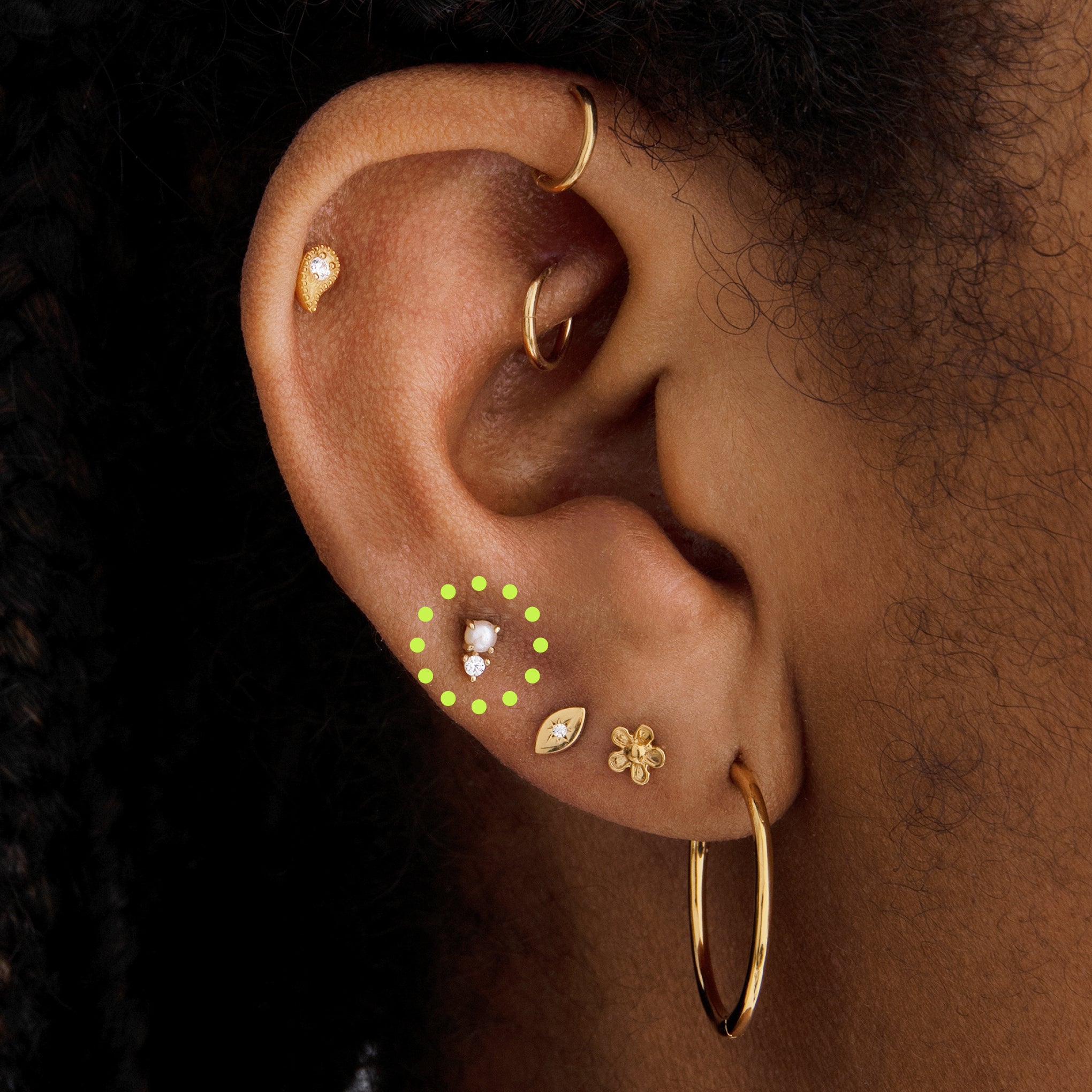 This is an image of a gold flatback stud with a pearl stacked cz stone on ear. - Alternative view 2
