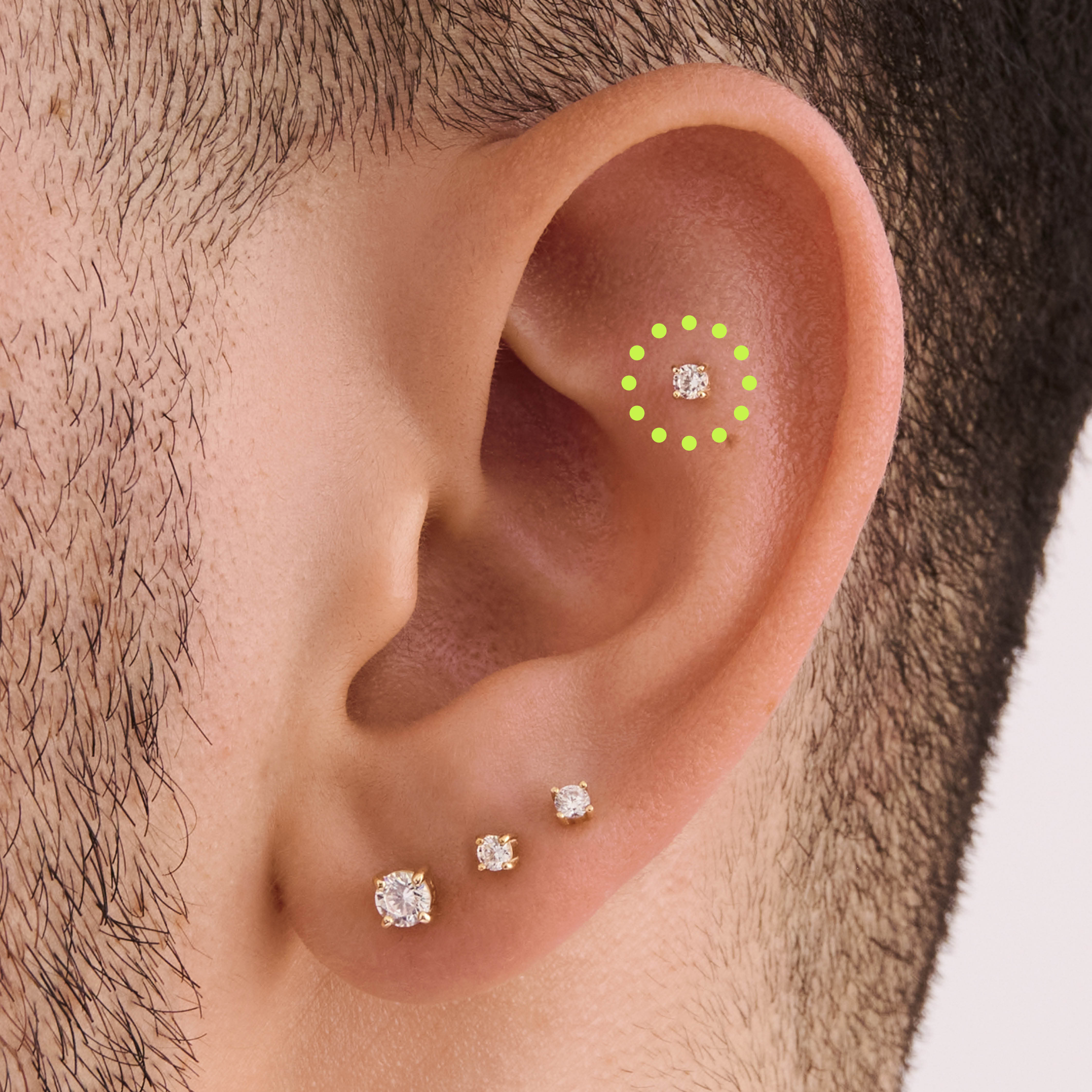 This is a 14k gold flatback stud with a clear mini lab-grown diamond on ear. [hover] color:null|gold/clear