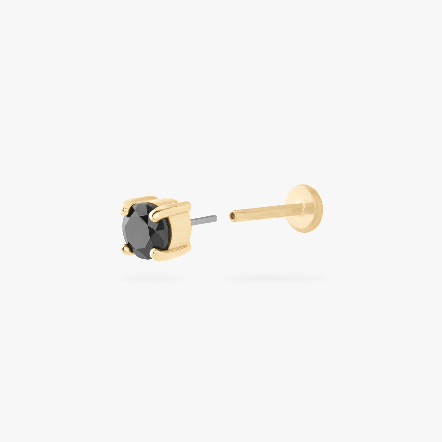 a 14k 4mm cz flatback stud with a black cz stone color:null|gold/black