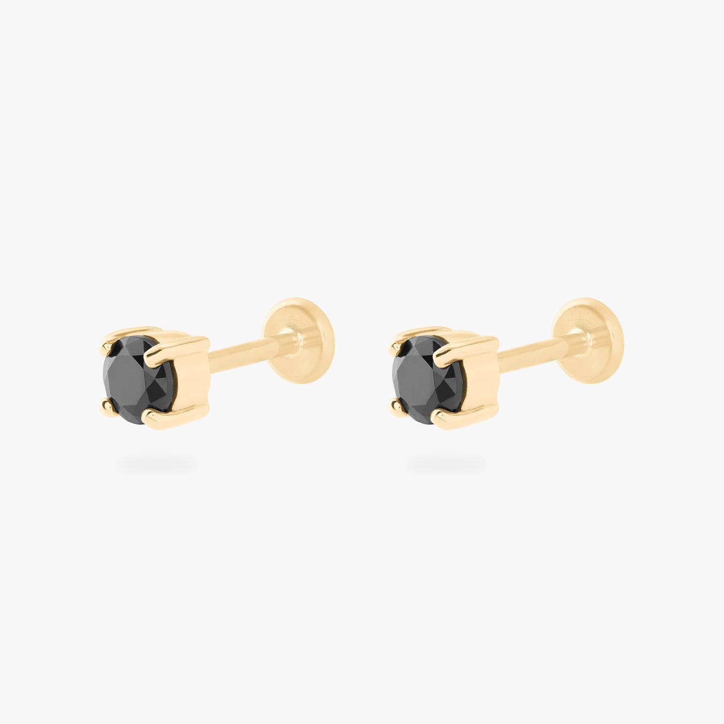 a 14k 4mm cz flatback stud with a black cz stone [pair] color:null|gold/black