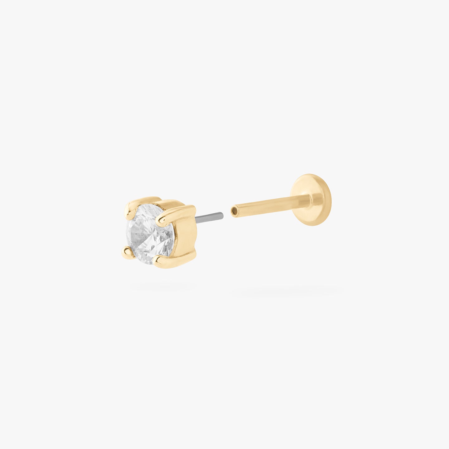 a 14k 4mm cz flatback stud with a clear cz stone color:null|gold/clear