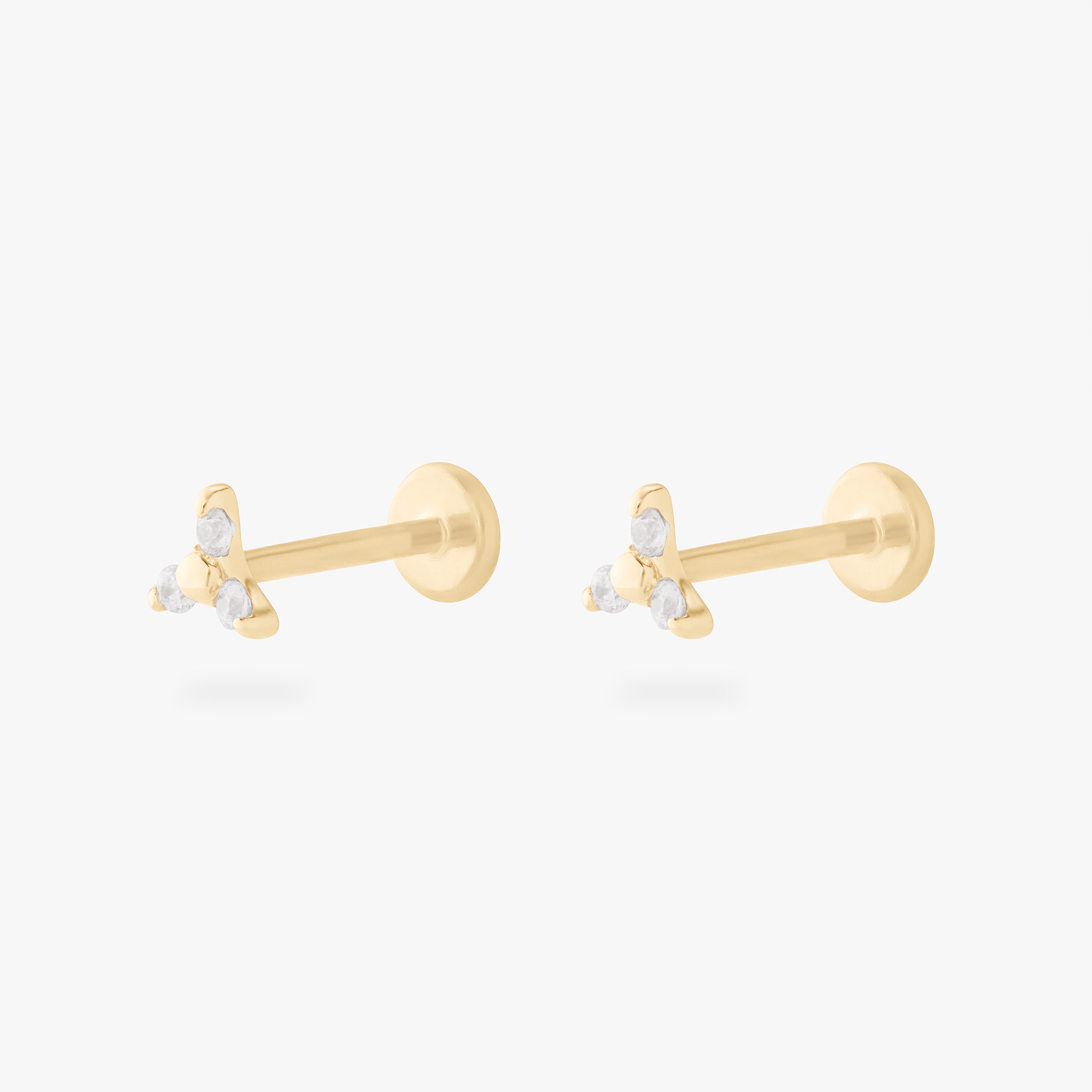 This is an image of a pair of gold flatback studs that each have 3 cz stones in the shape of a triangle. - Alternative view 6
