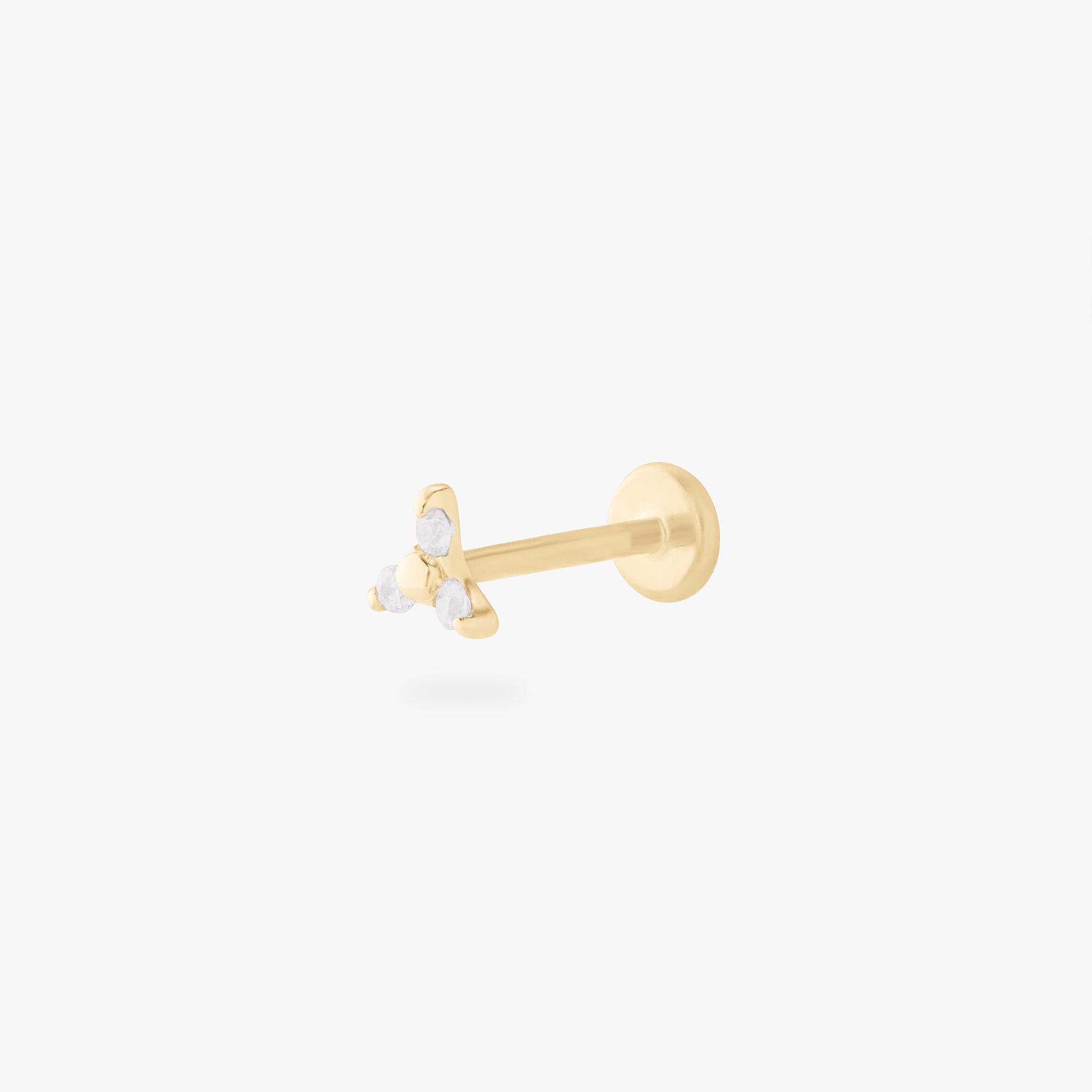 This is an image of a gold flatback stud that has 3 cz stones in the shape of a triangle. - Main view