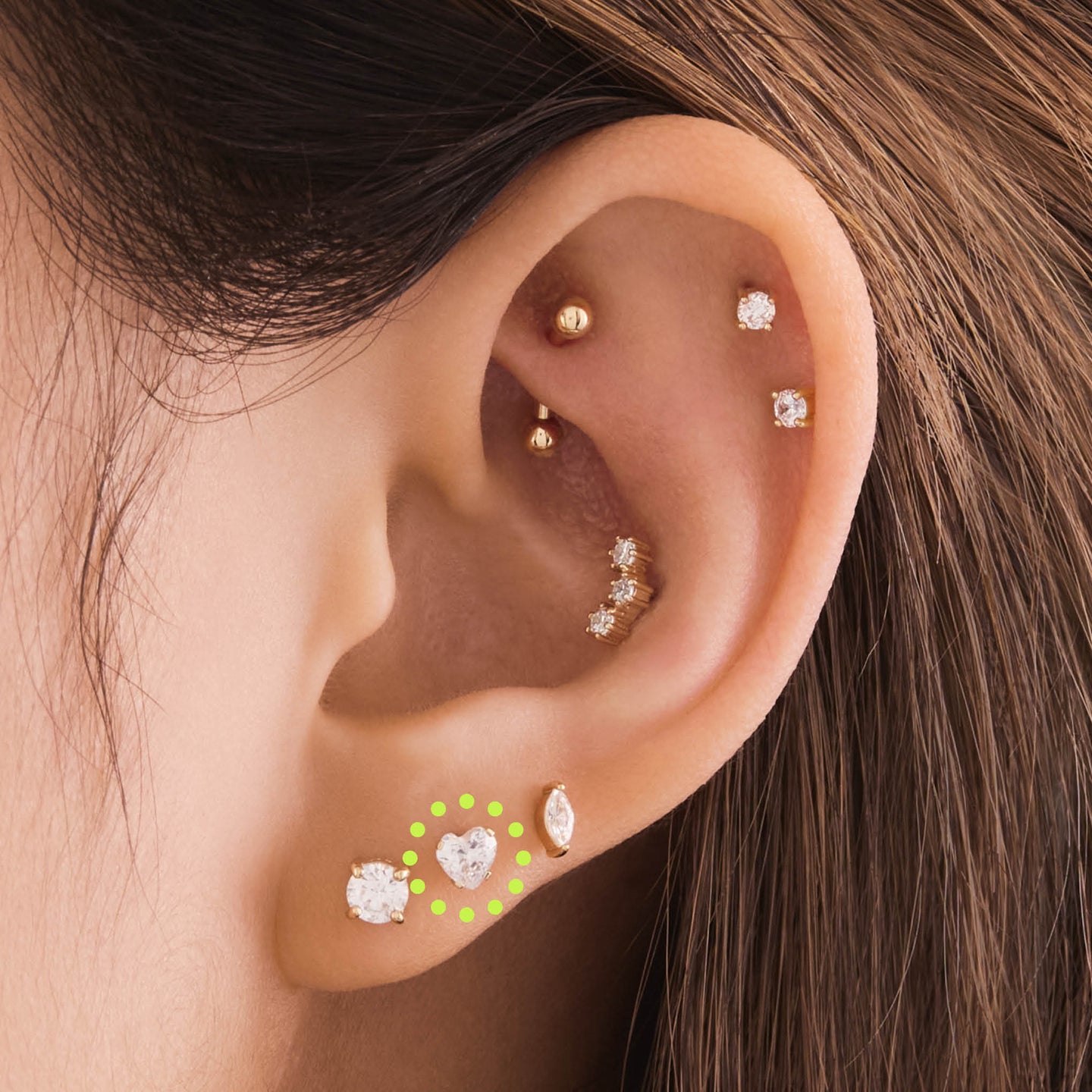 on ear featuring a 14k heart cz flatback in gold with a clear stone [hover] color:null|gold/clear